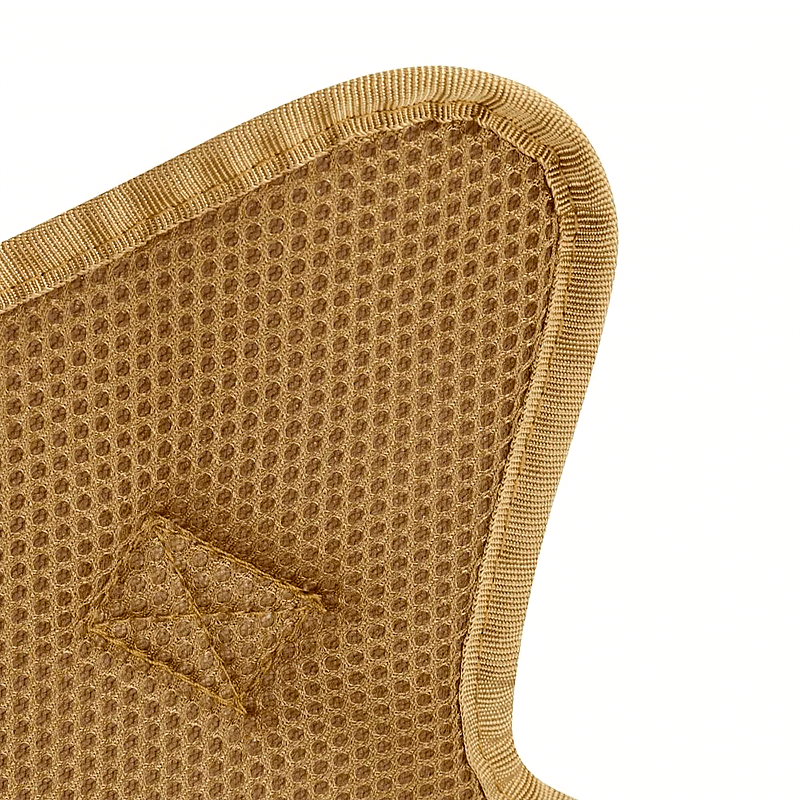 Close-up of a brown dog harness's breathable mesh lining with reinforced stitching for durability and comfort.