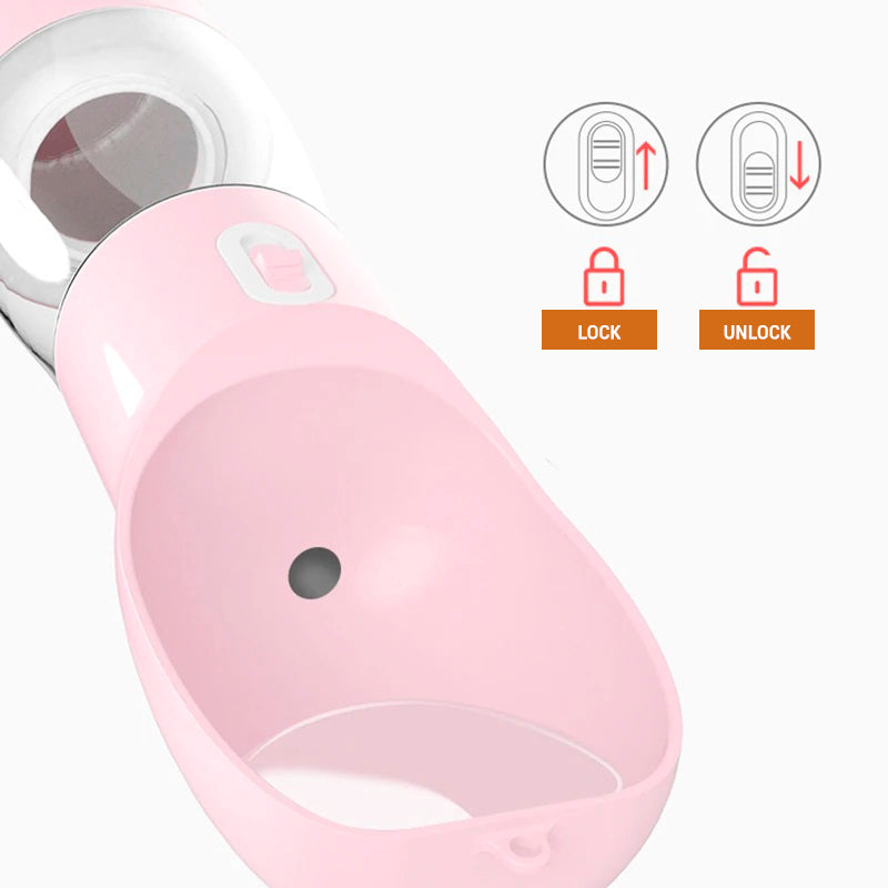 A close-up of a pink PetPal Water & Snack Bottle's lock and unlock mechanism for dispensing water, shown with instructional icons.